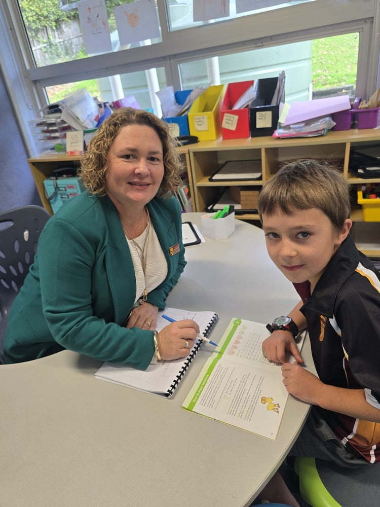 Teacher and student working together