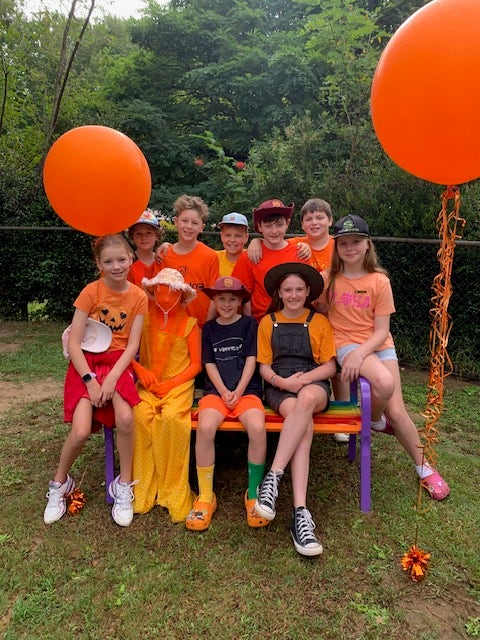 Students on buddy bench dressed for Harmony Week
