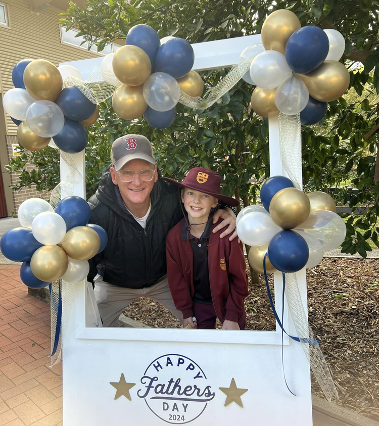 Father and son in photo booth
