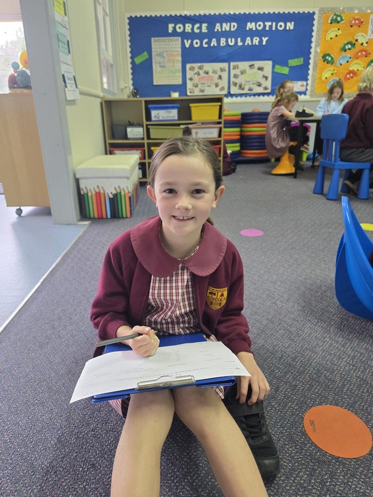 Student sitting on floor working